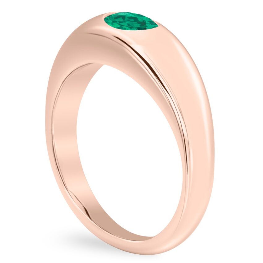 angle view of rose gold dome ring with east west set oval emerald gemstone