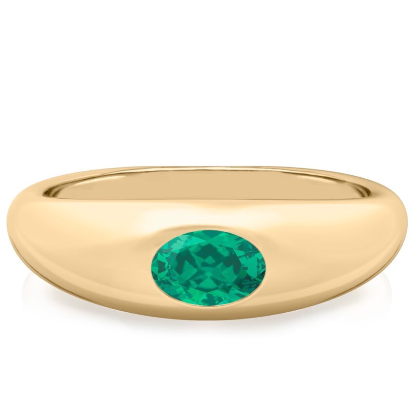 yellow gold dome ring with east west set oval emerald gemstone