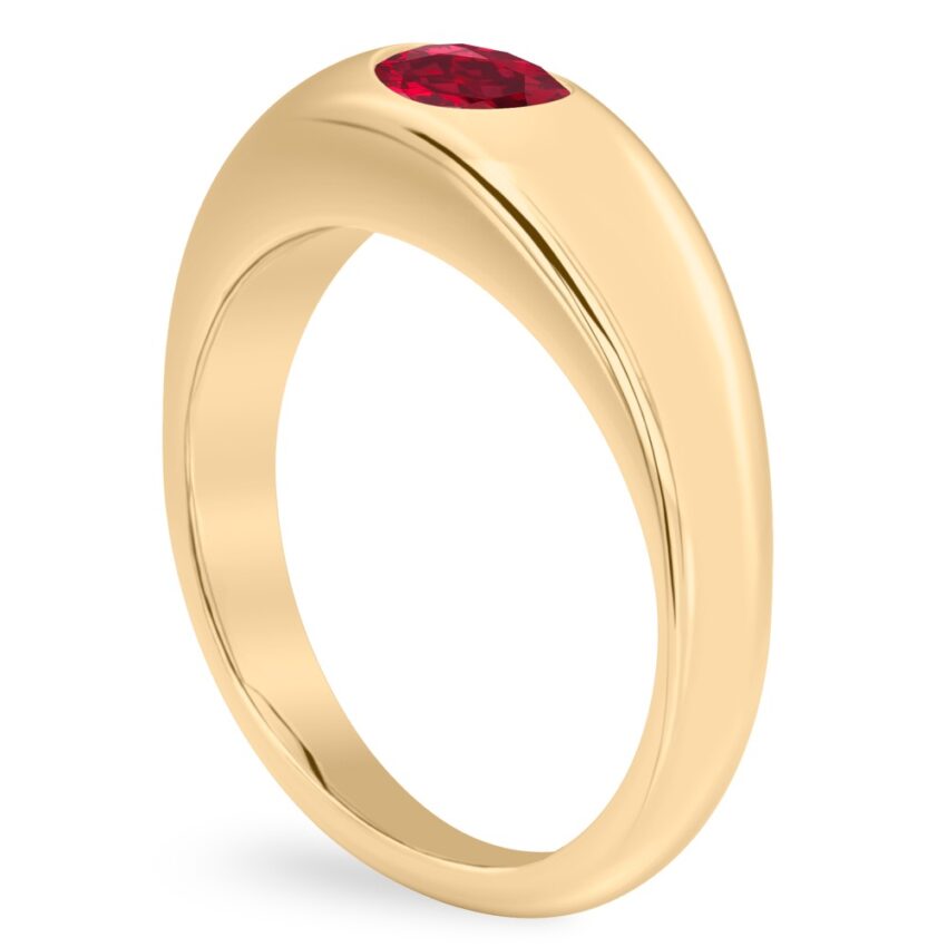 angle view of yellow gold dome ring with east west set oval ruby gemstone