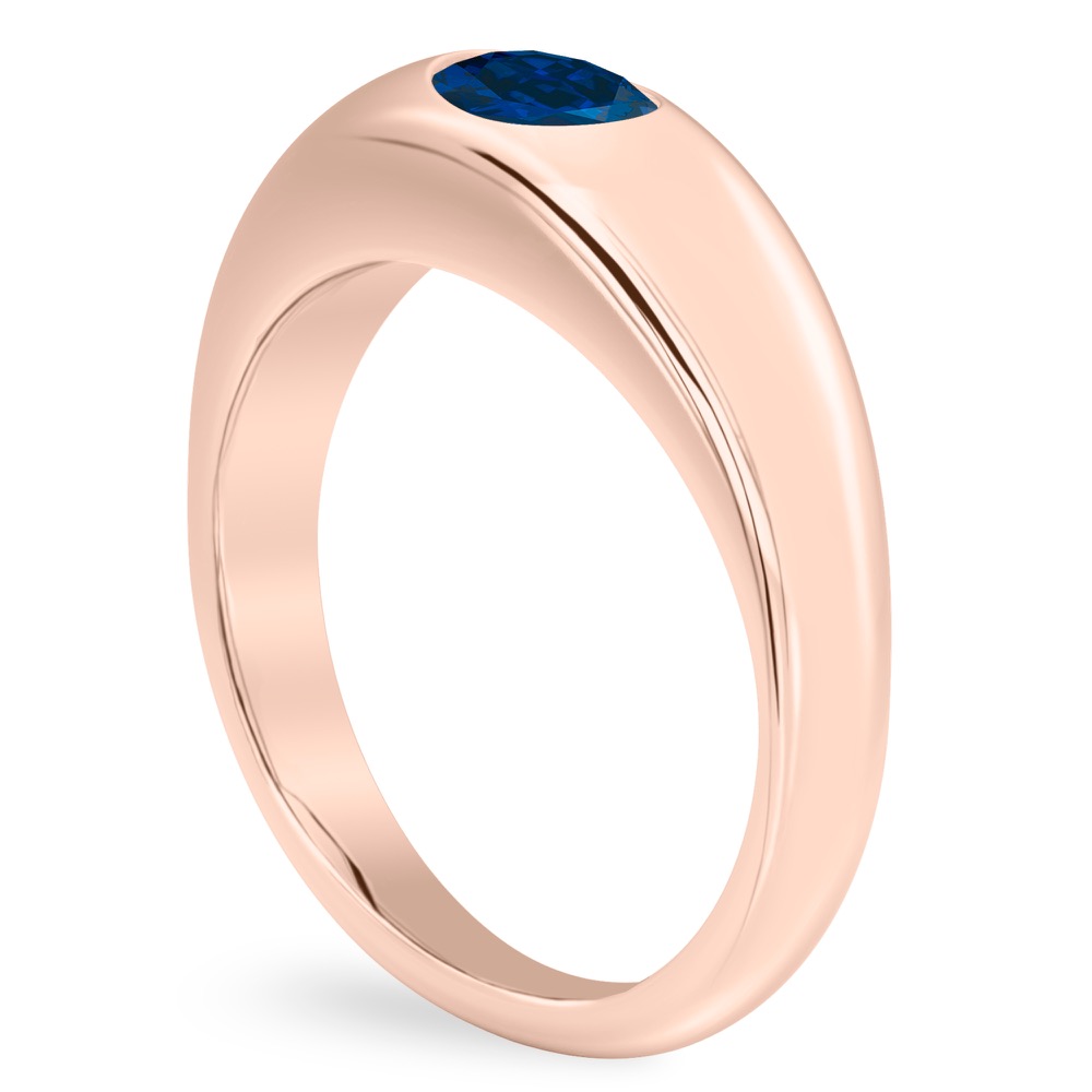 angle view of dome ring in rose gold with oval blue sapphire