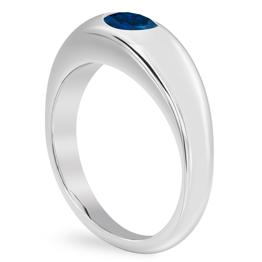 angle view of dome ring in white gold with oval blue sapphire