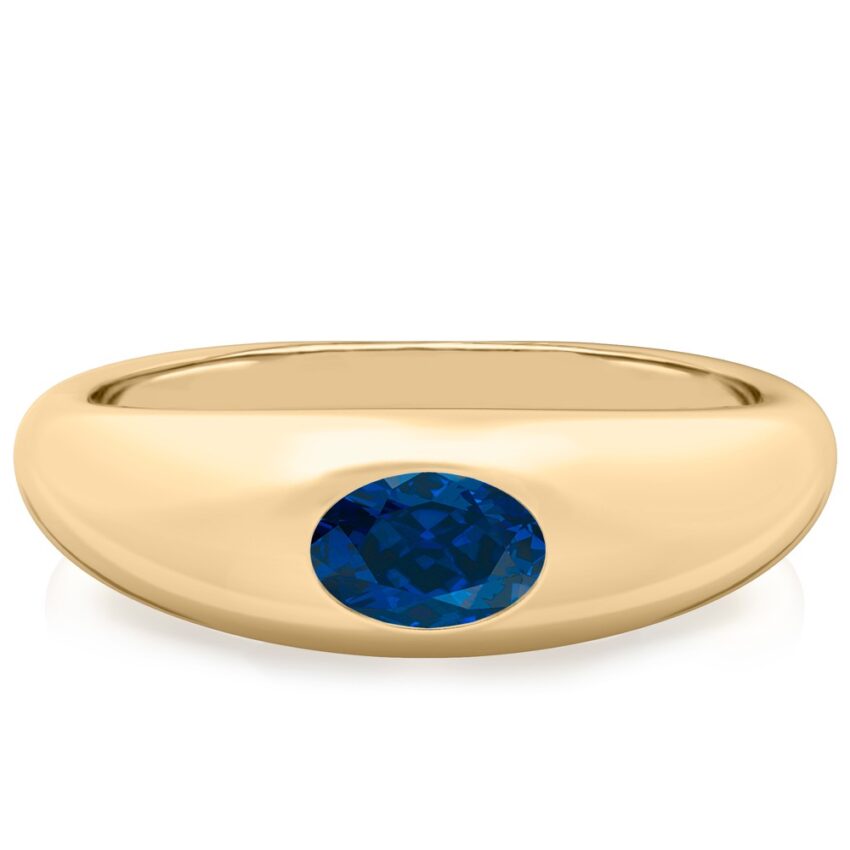 domed ring in yellow gold with oval blue sapphire