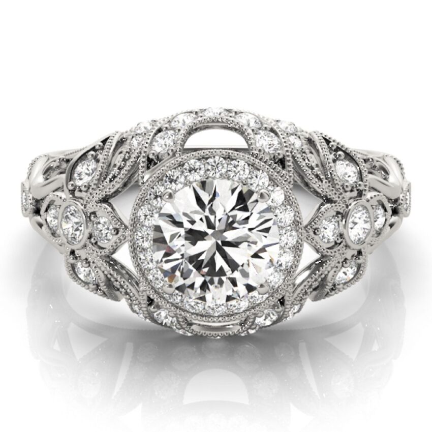 ornate vintage halo ring with side stones and milgrain platinum