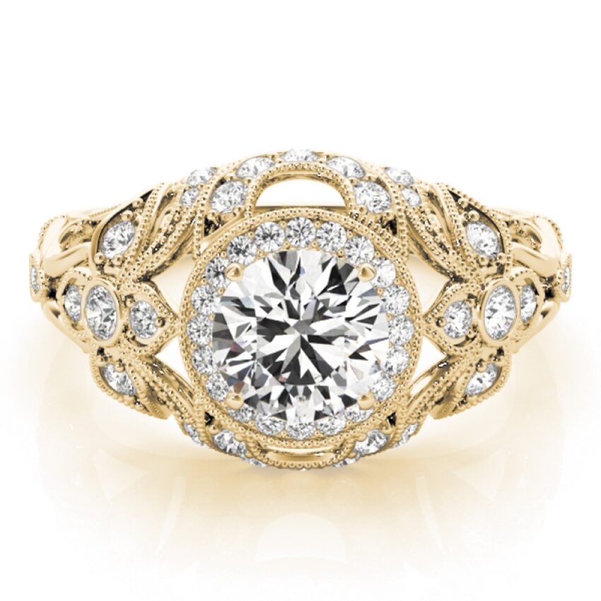 ornate vintage halo ring with side stones and milgrain yellow gold