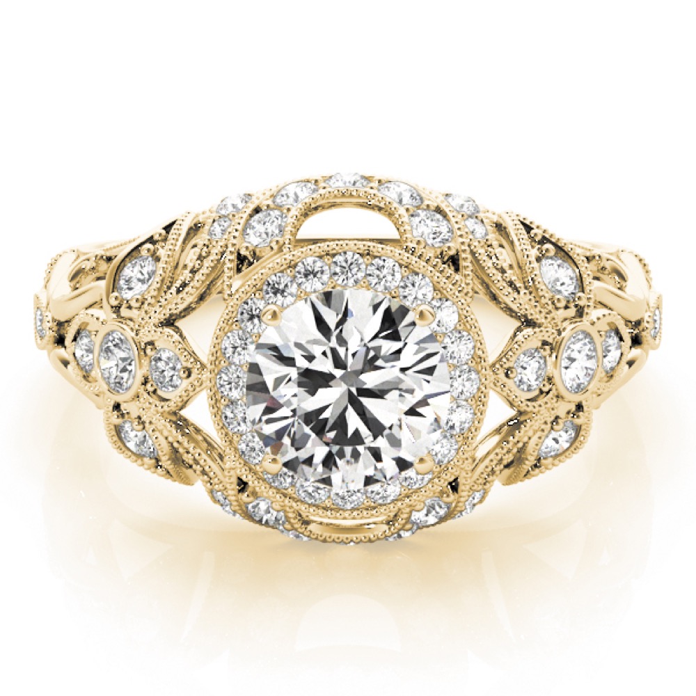 ornate vintage halo ring with side stones and milgrain yellow gold