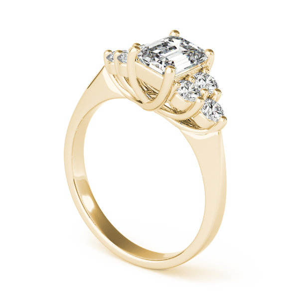 angle view of cluster side stone trellis engagement ring in yellow gold with emerald cut diamond