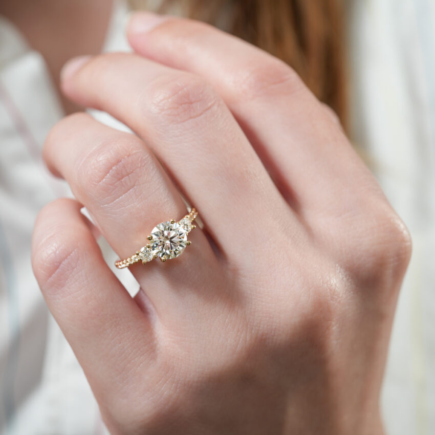 pave three stone engagement ring in lifestyle