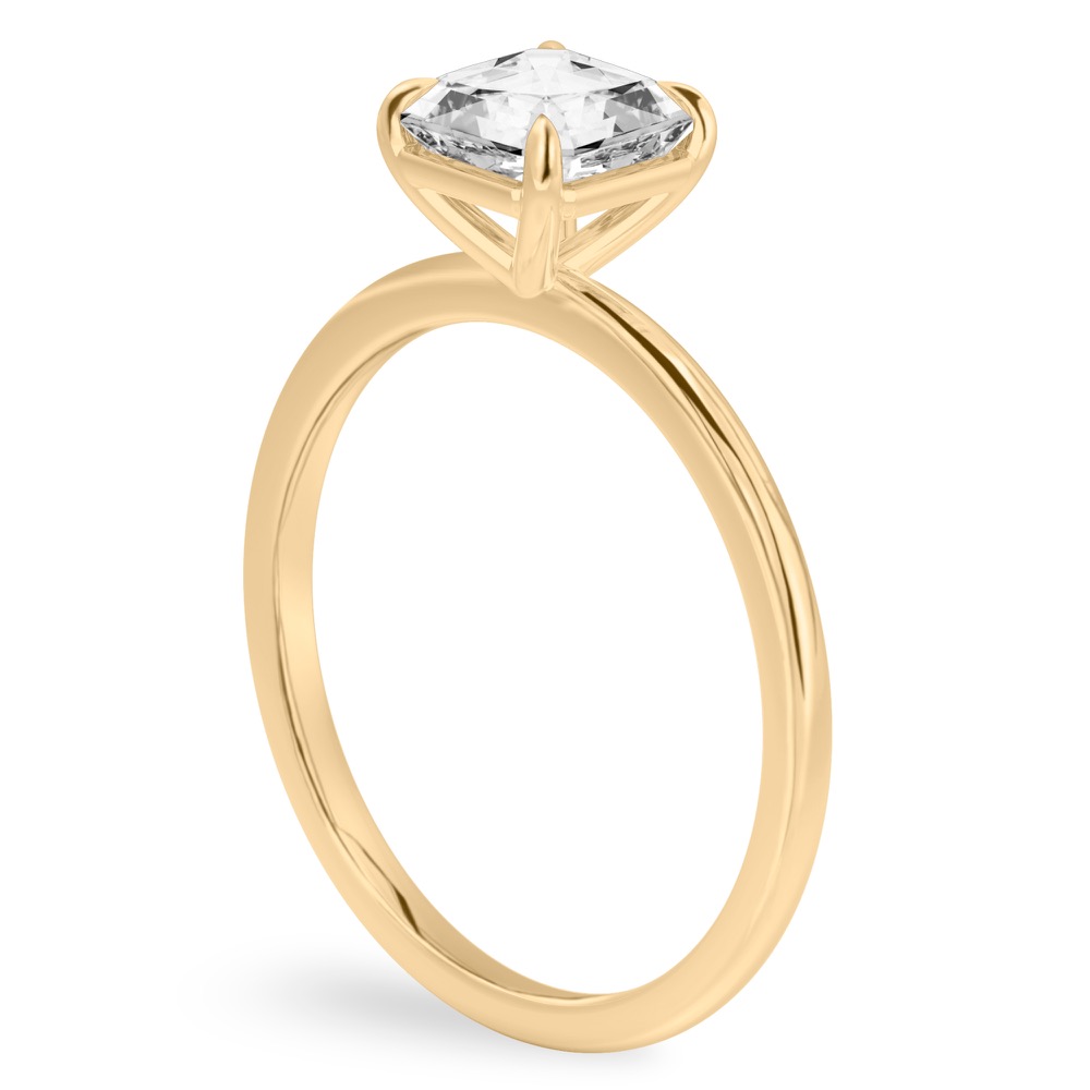 Angle view of asscher cut diamond delicate solitaire engagement ring yellow gold