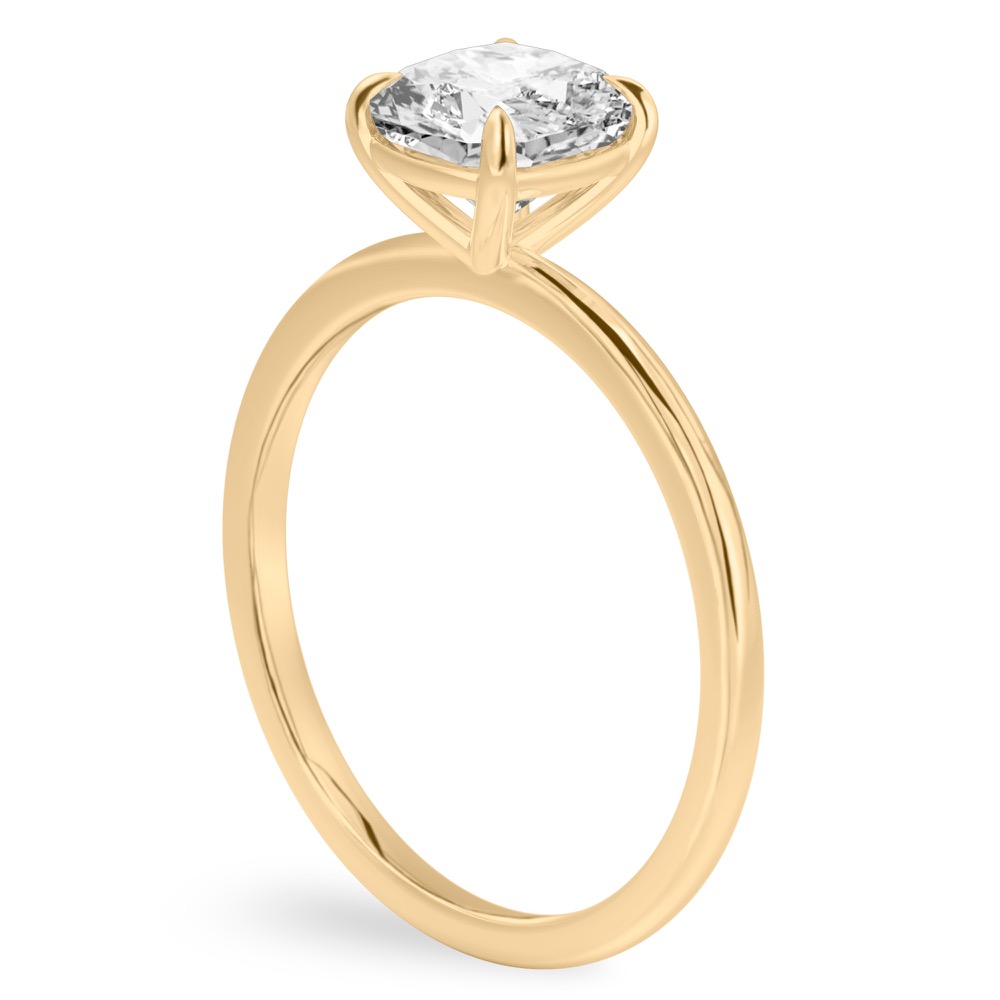 Angle view of cushion cut diamond delicate solitaire engagement ring yellow gold