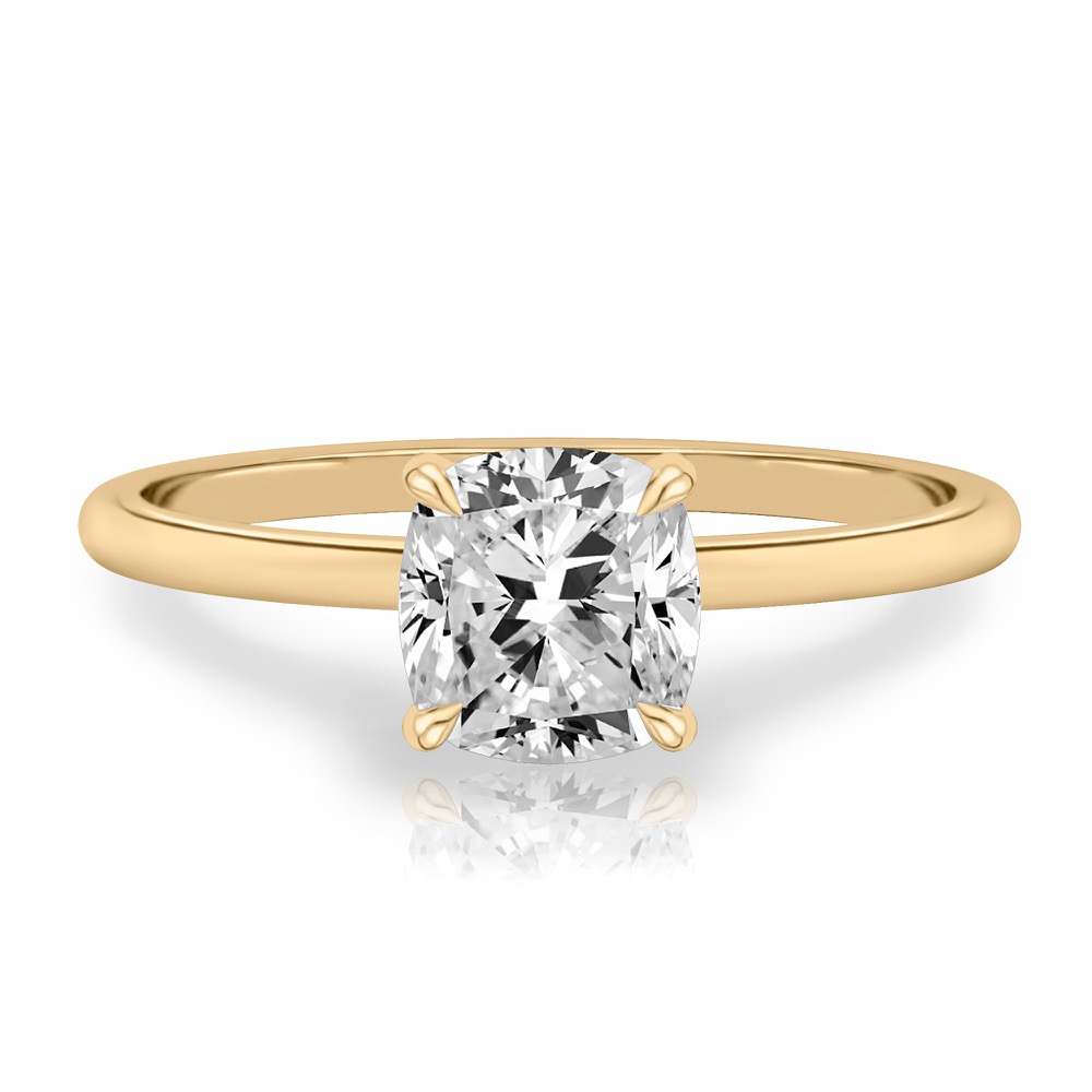 cushion cut diamond delicate solitaire engagement ring in yellow gold