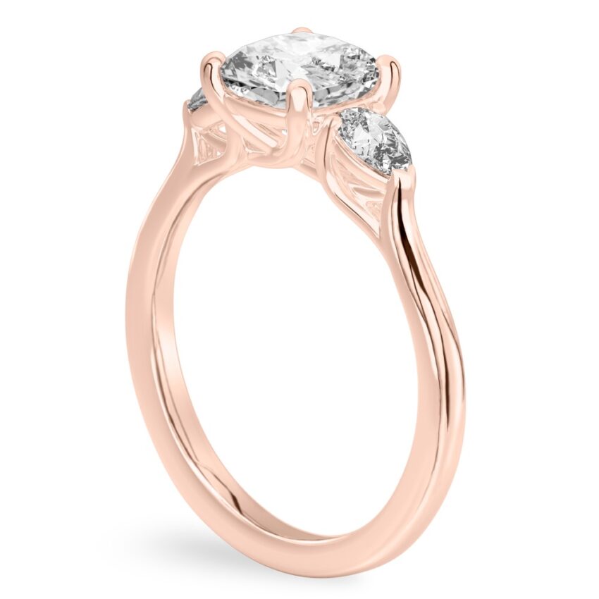 cushion cut diamond pear side stone engagement ring rose gold angle