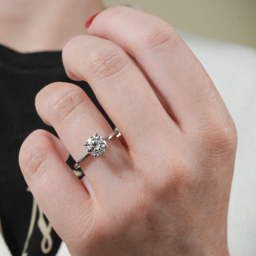 dainty solitaire engagement ring in lifestyle
