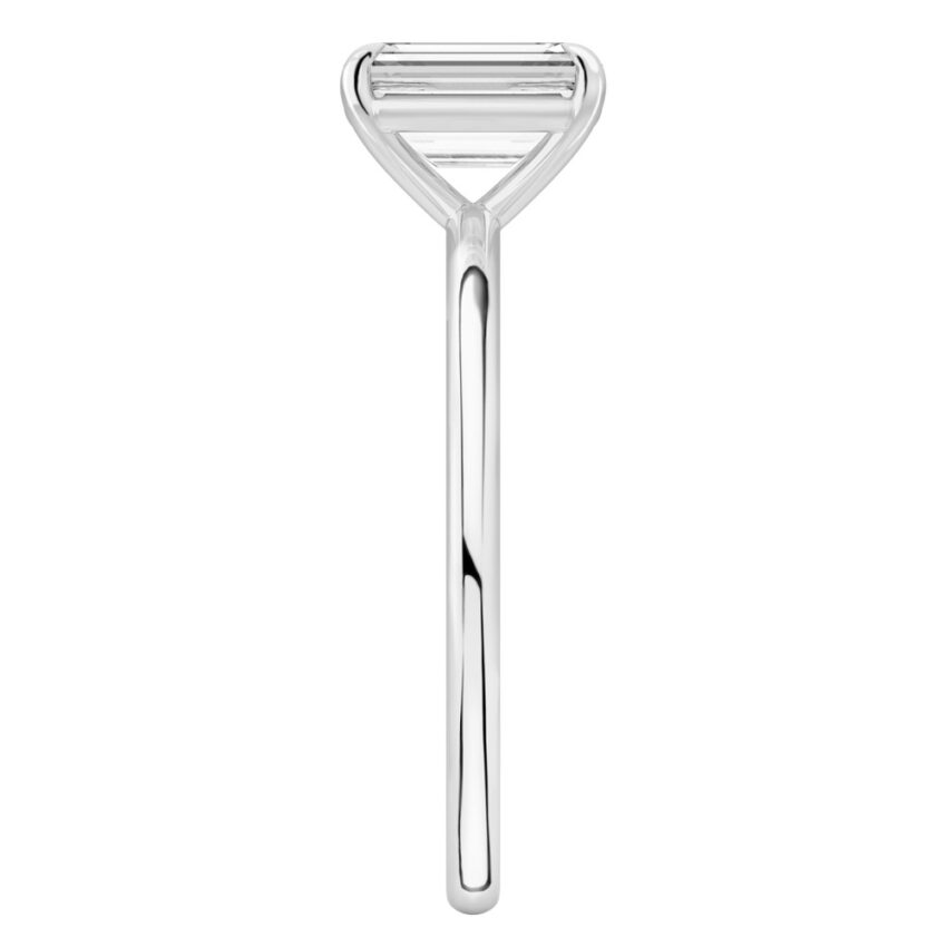 Side view of emerald cut diamond delicate solitaire engagement ring palladium