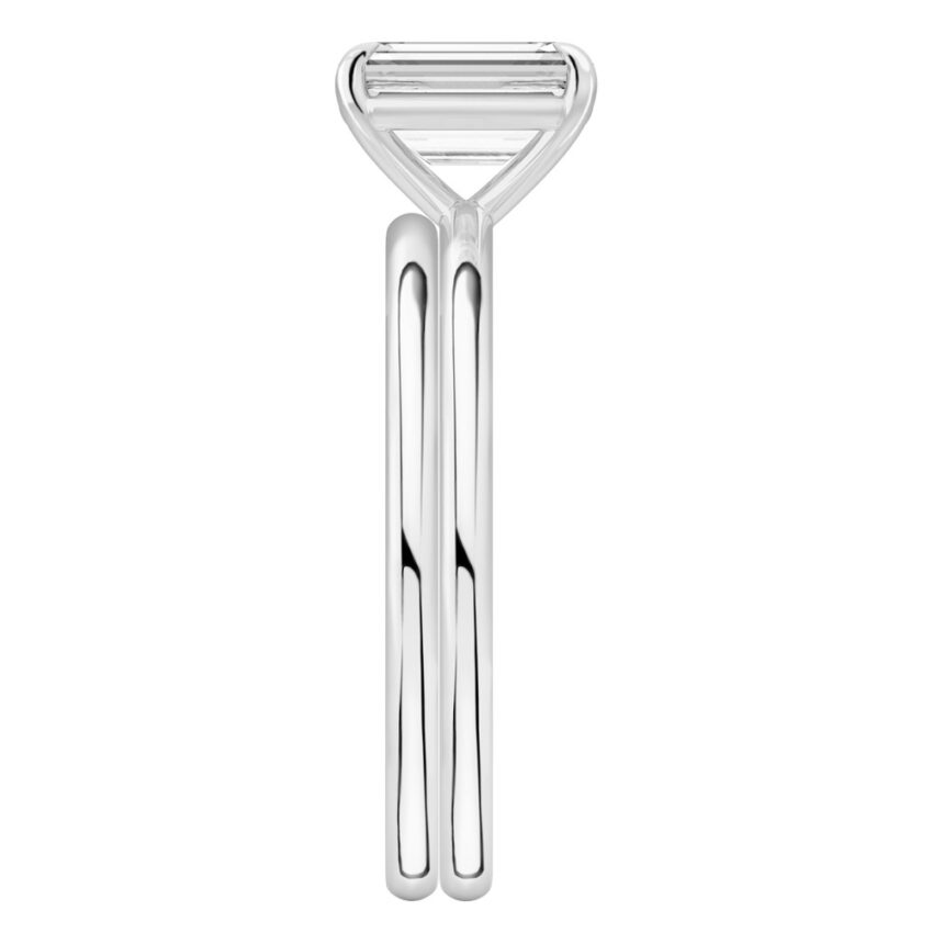 Side view of emerald cut diamond delicate solitaire engagement ring set platinum