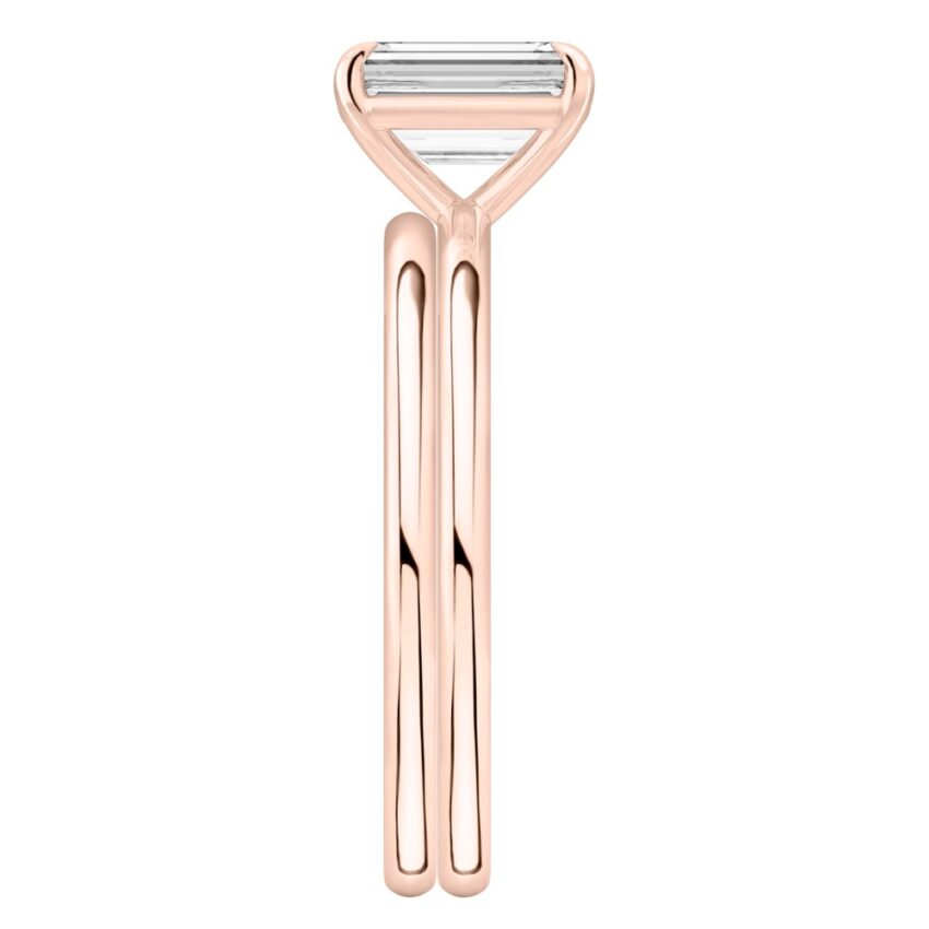Side view of emerald cut diamond delicate solitaire engagement ring set rose gold