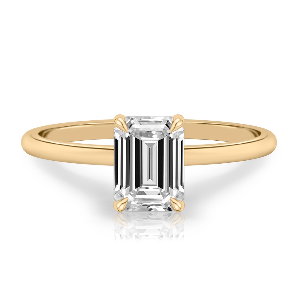 emerald cut diamond delicate solitaire engagement ring in yellow gold