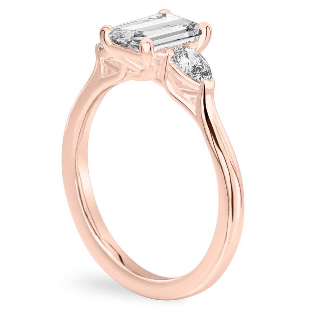 emerald cut diamond pear side stone engagement ring rose gold angle