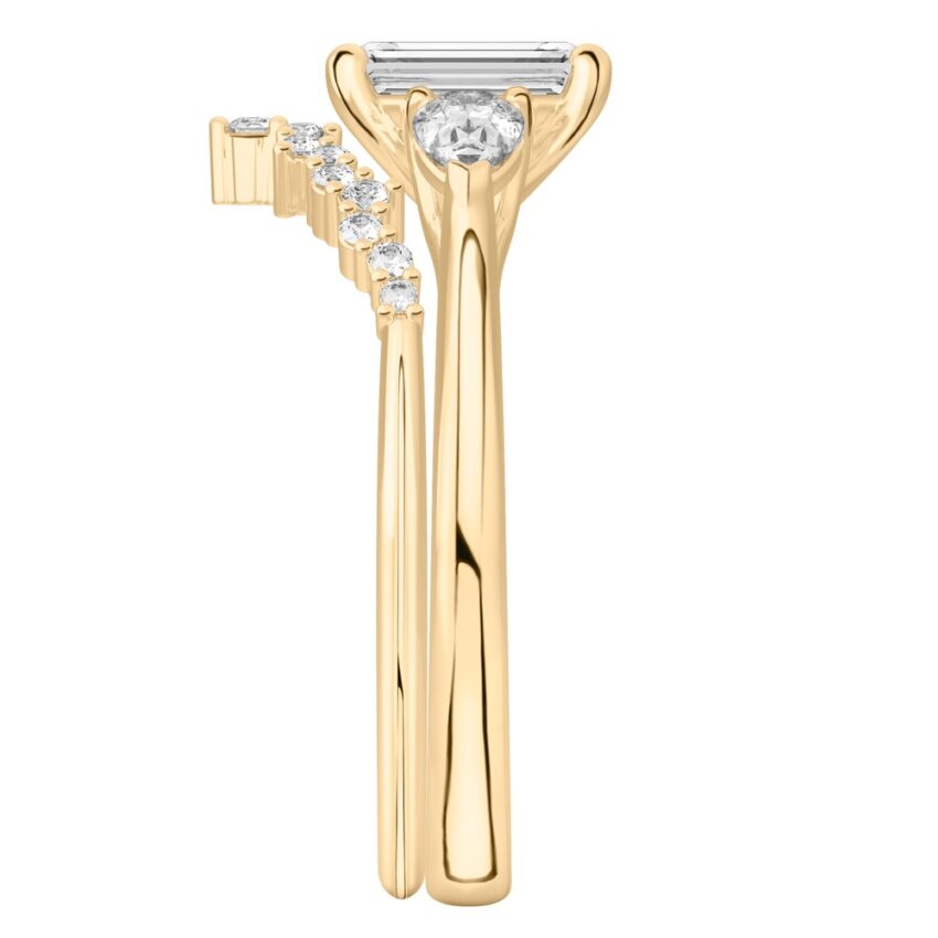 emerald cut diamond pear side stone engagement ring set yellow gold side