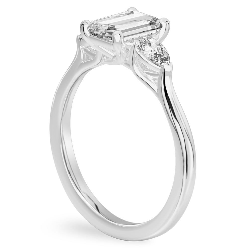 emerald cut diamond pear side stone engagement ring white gold angle