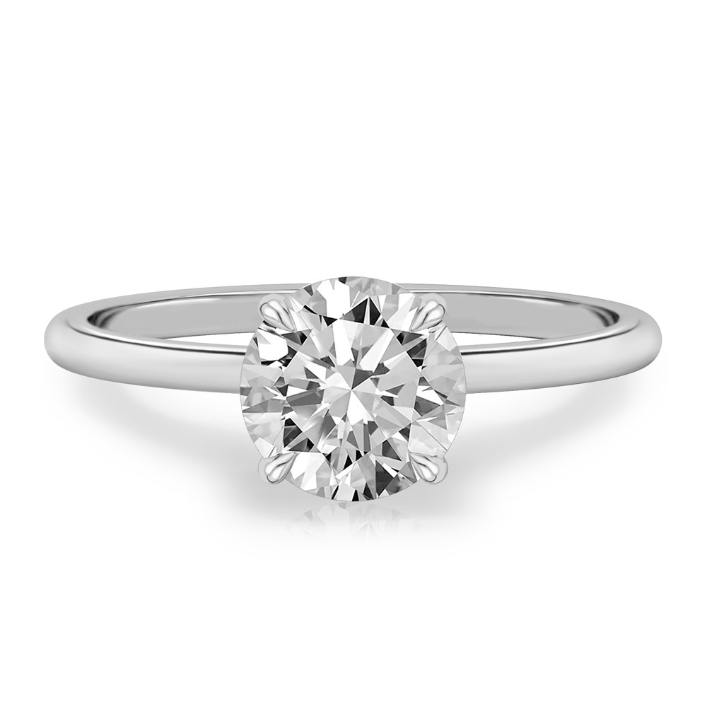 four prong round cut diamond delicate solitaire engagement ring in palladium