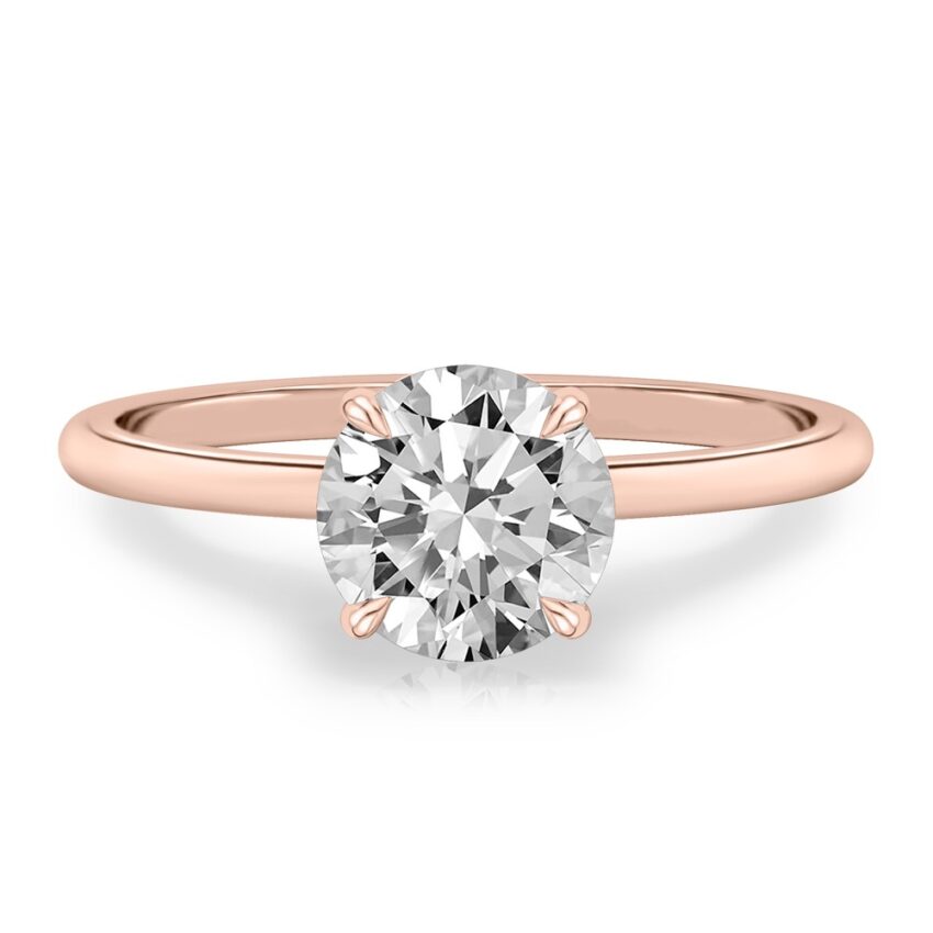 four prong round cut diamond delicate solitaire engagement ring in rose gold