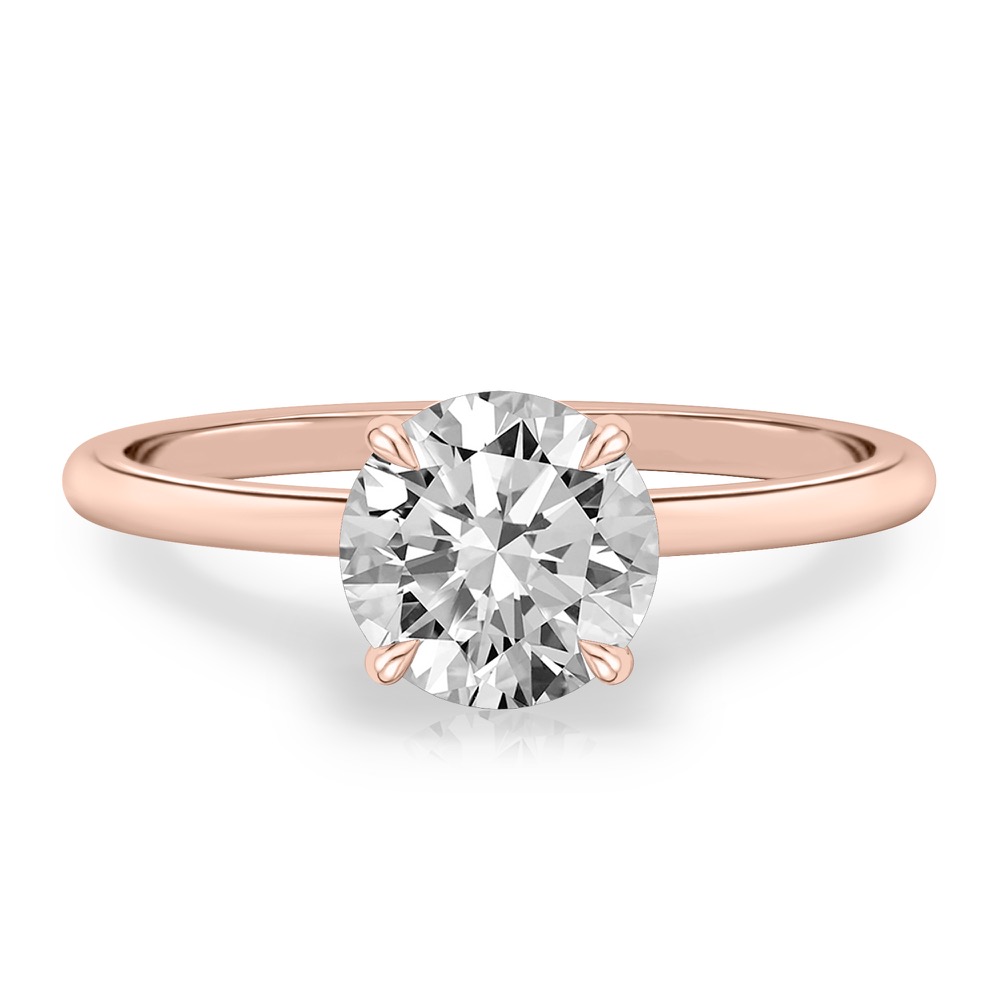 four prong round cut diamond delicate solitaire engagement ring in rose gold