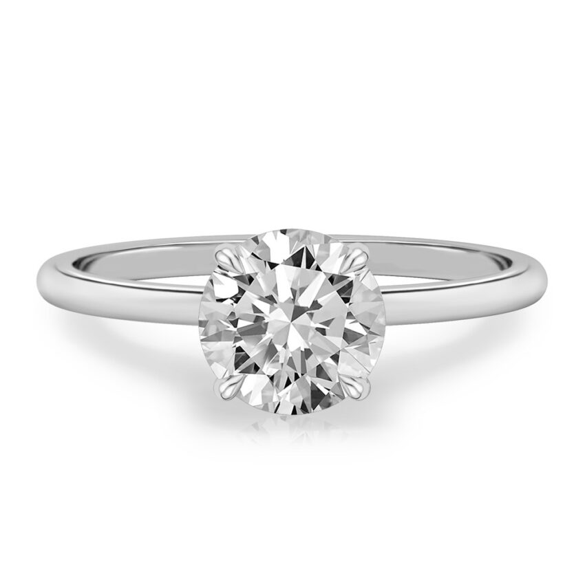 four prong round cut diamond delicate solitaire engagement ring in white gold