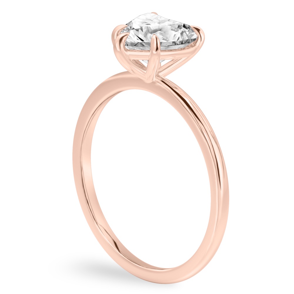 Angle view of heart shape diamond delicate solitaire engagement ring rose gold