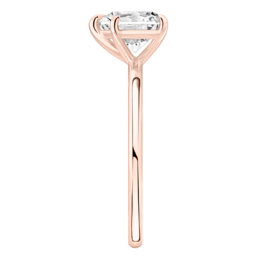 Side view of heart shape diamond delicate solitaire engagement ring rose gold