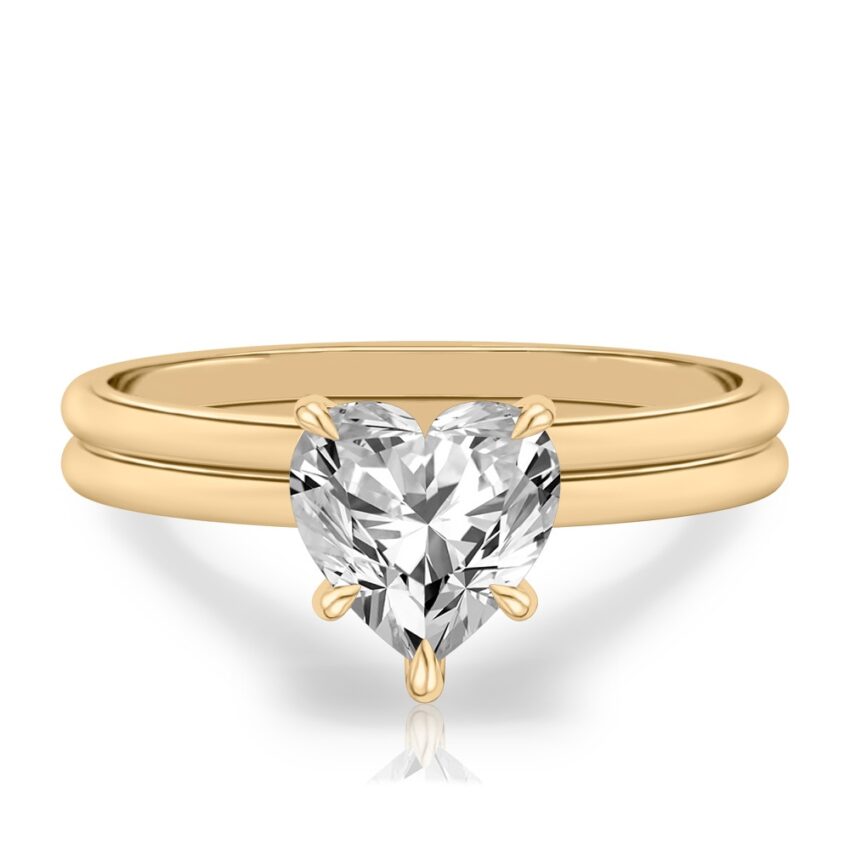 heart shape diamond delicate solitaire engagement ring in set yellow gold