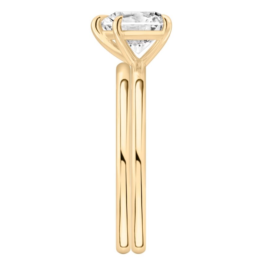 Side view of heart shape diamond delicate solitaire engagement ring set yellow gold