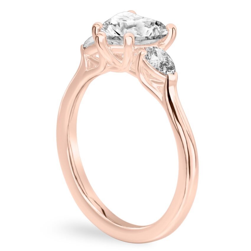 heart shape diamond pear side stone engagement ring rose gold angle