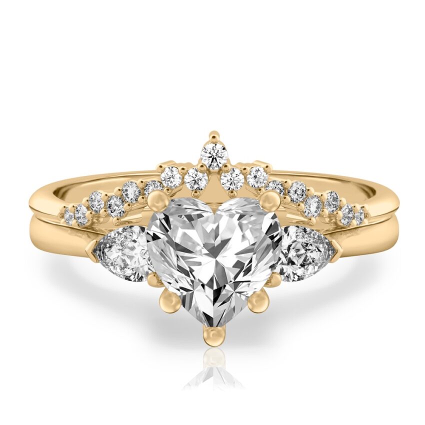 heart shape diamond pear side stone engagement ring set yellow gold