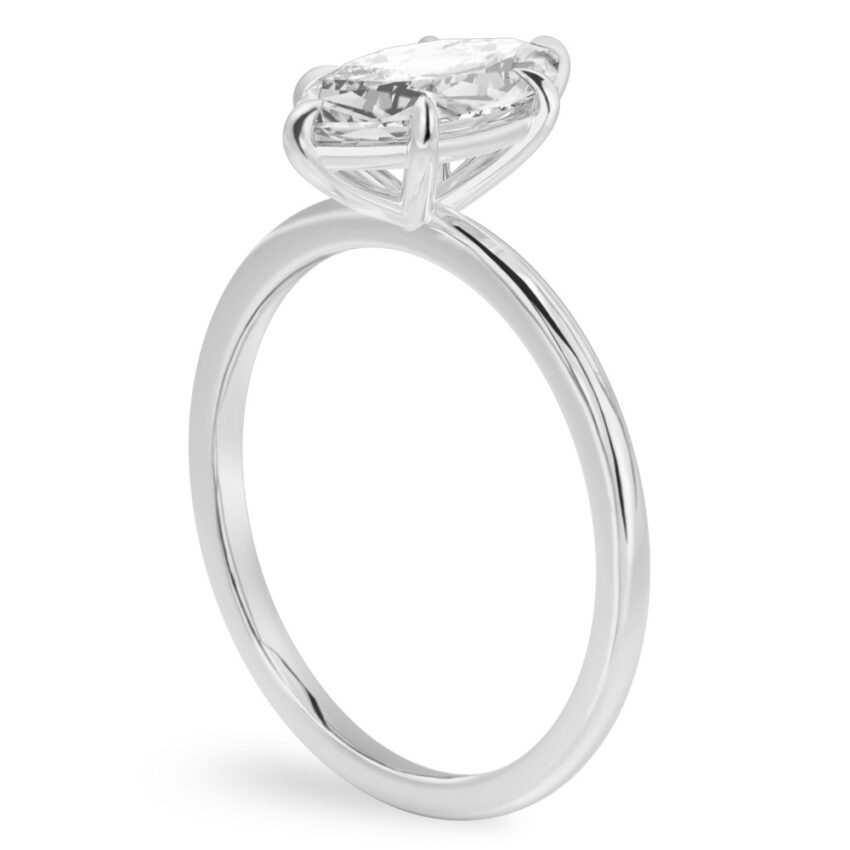 Angle view of marquise cut diamond delicate solitaire engagement ring palladium