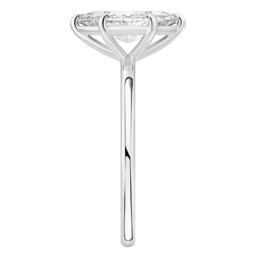 Side view of marquise cut diamond delicate solitaire engagement ring palladium