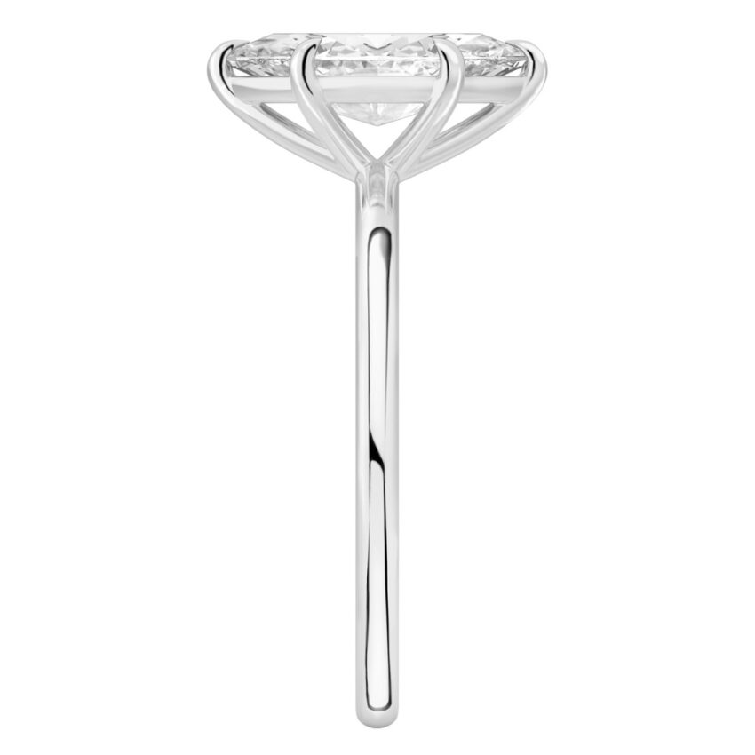 Side view of marquise cut diamond delicate solitaire engagement ring platinum
