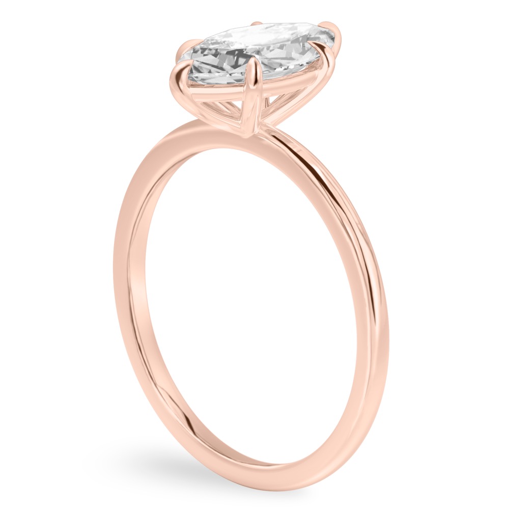 Angle view of marquise cut diamond delicate solitaire engagement ring rose gold