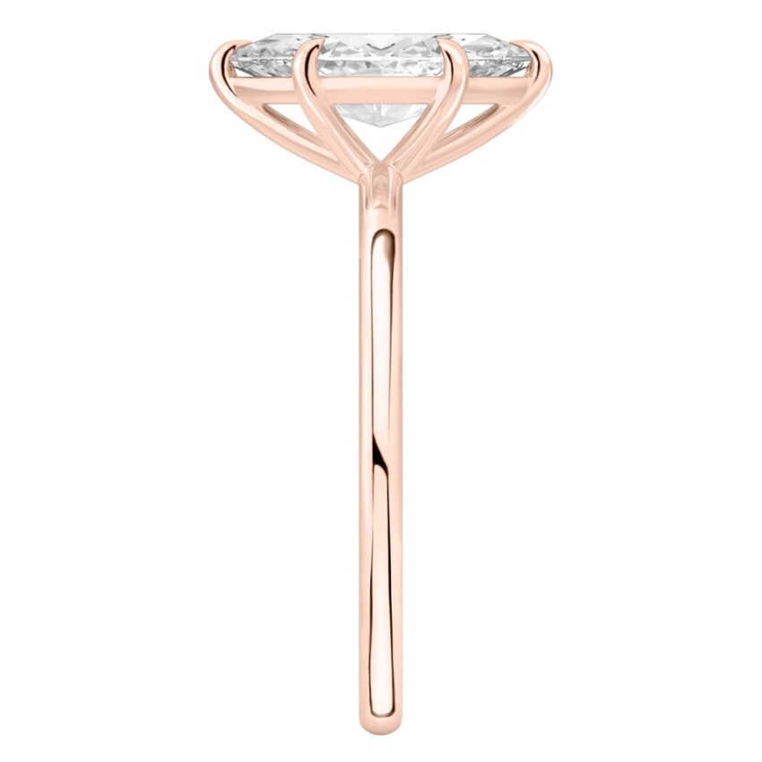 Side view of marquise cut diamond delicate solitaire engagement ring rose gold
