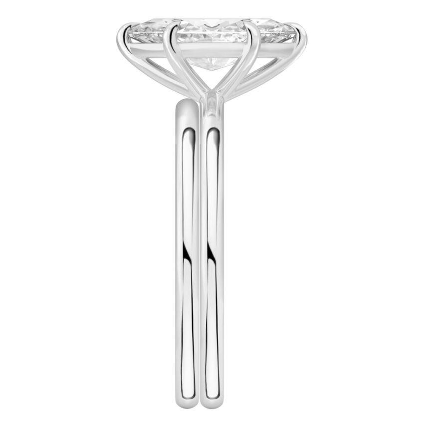 Side view of marquise cut diamond delicate solitaire engagement ring set platinum