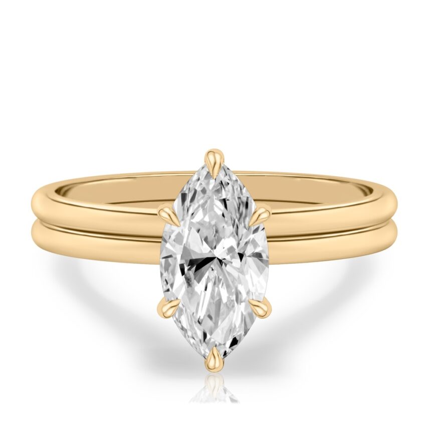 marquise cut diamond delicate solitaire engagement ring in set yellow gold