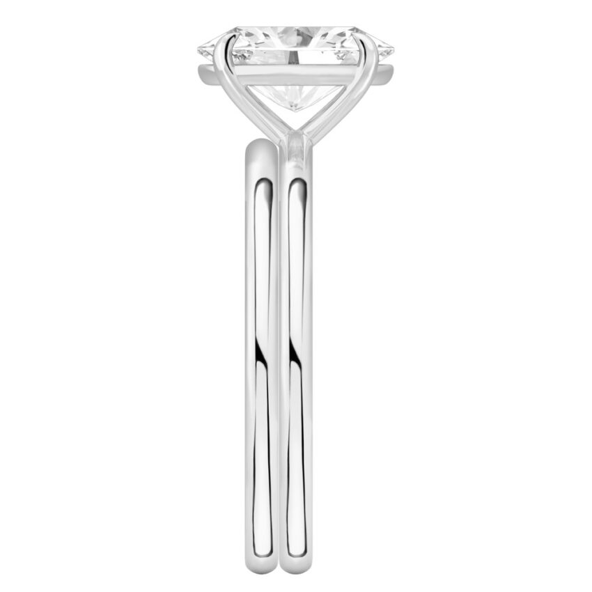 Side view of oval shape diamond delicate solitaire engagement ring set platinum