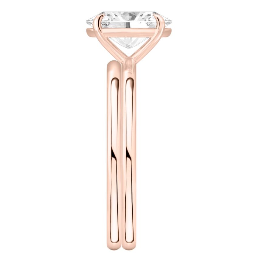 Side view of oval shape diamond delicate solitaire engagement ring set rose gold