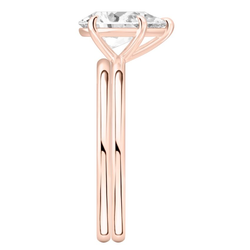 Side view of pear shape diamond delicate solitaire engagement ring set rose gold