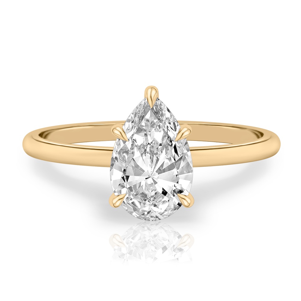 pear shape diamond delicate solitaire engagement ring in yellow gold