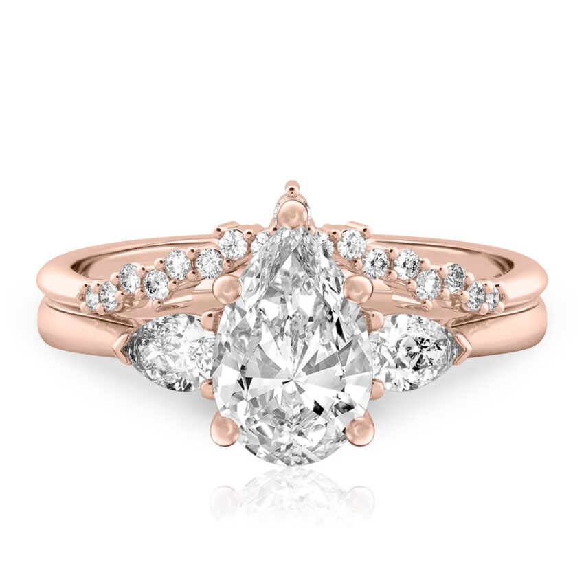 pear shape diamond pear side stone engagement ring set rose gold