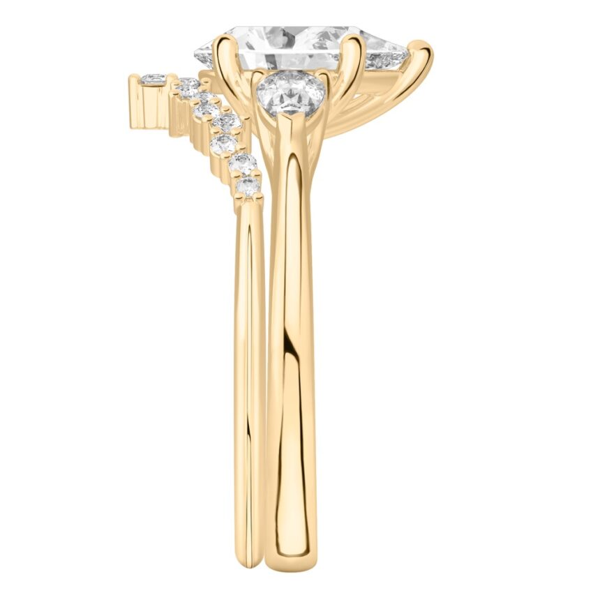 pear shape diamond pear side stone engagement ring set yellow gold side
