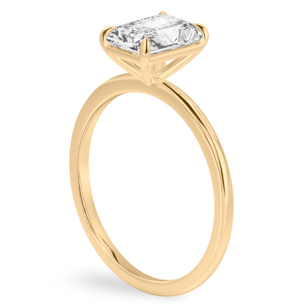 Angle view of radiant cut diamond delicate solitaire engagement ring yellow gold