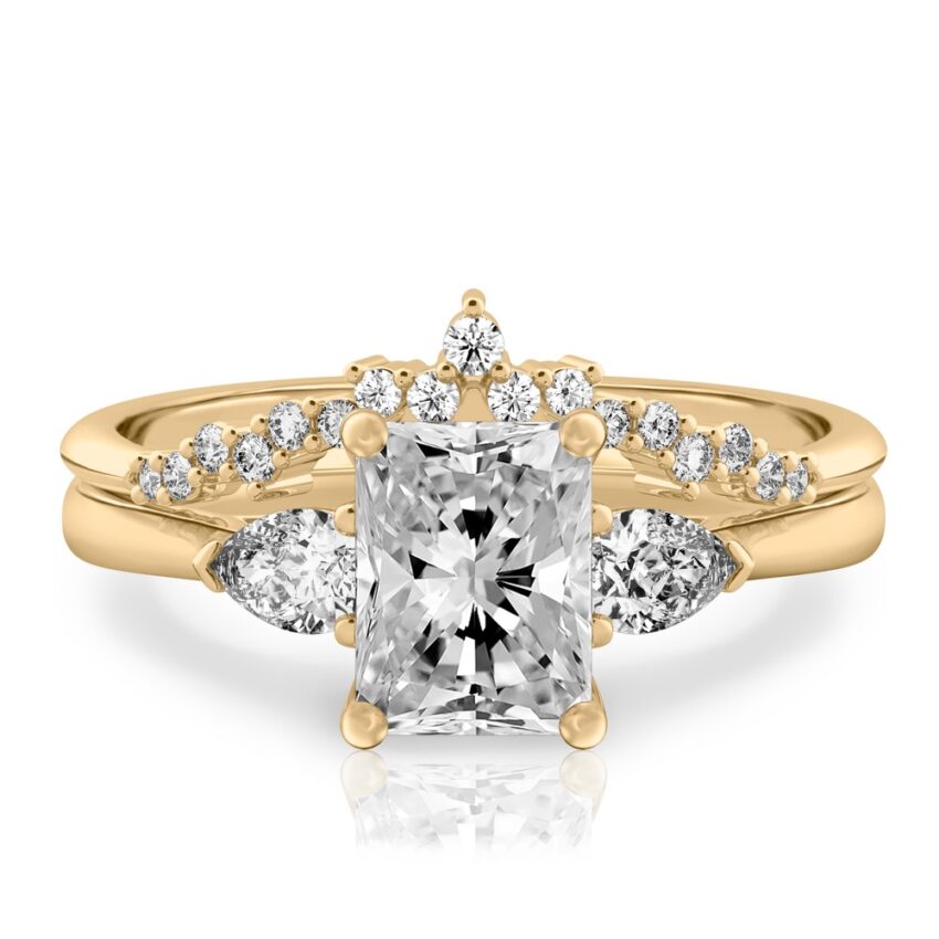 radiant cut diamond pear side stone engagement ring set yellow gold
