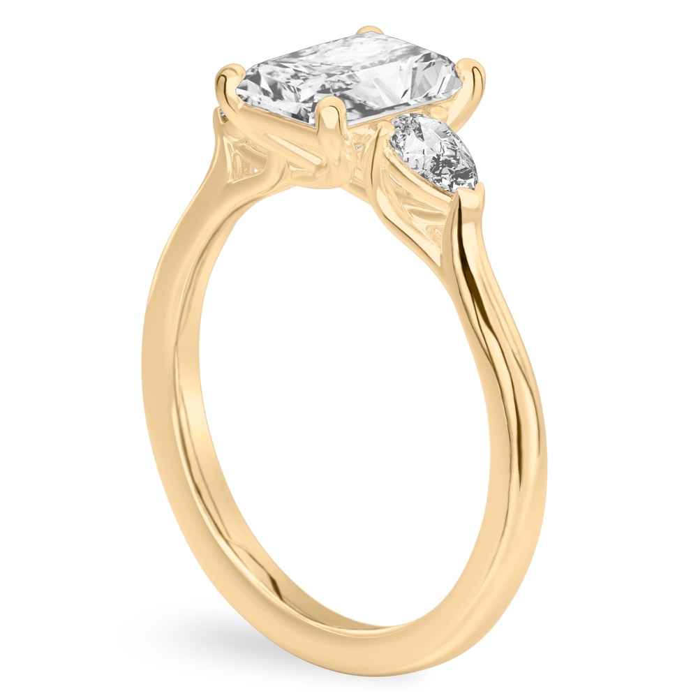 radiant cut diamond pear side stone engagement ring yellow gold angle