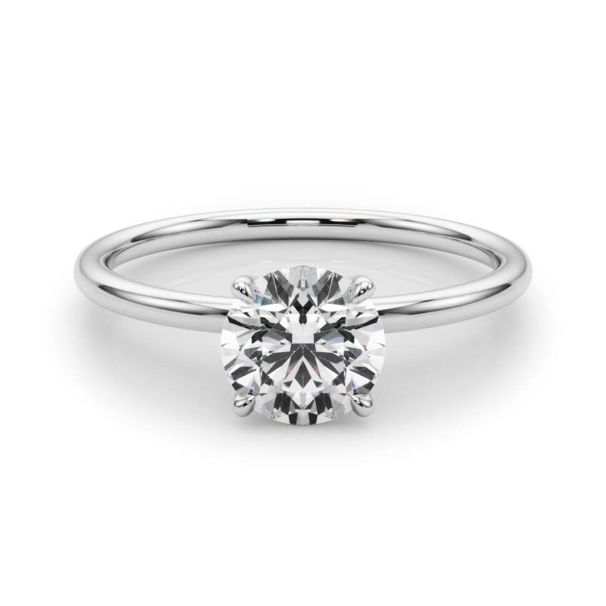round cut diamond dainty solitaire engagement ring in platinum